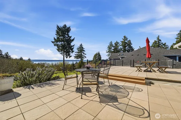 a view of a patio with a table and chairs