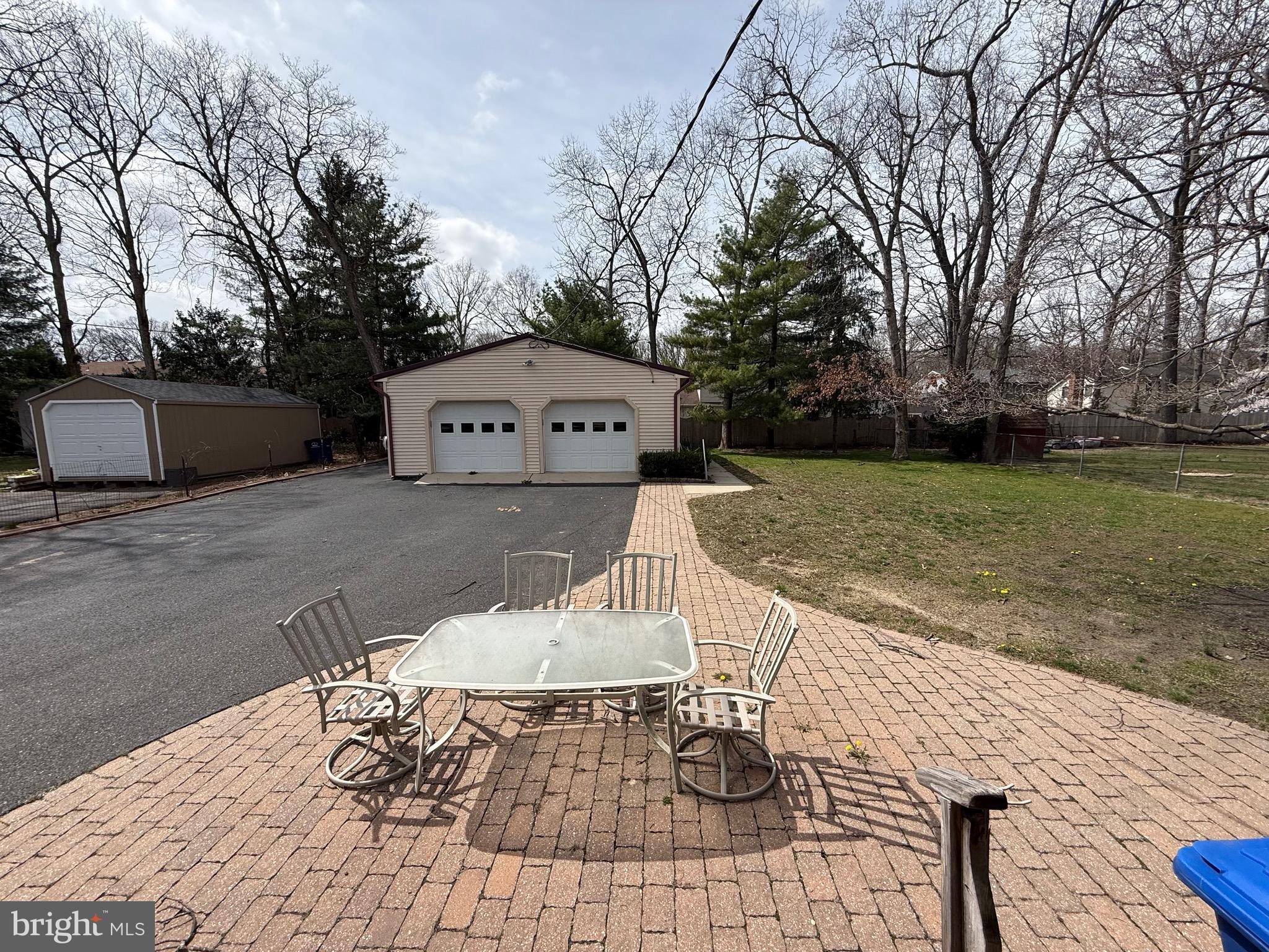 310 Timberline Drive Mount Laurel, NJ 08054 - Photo 12 of 15 a table and chairs sitting in the middle of a yard