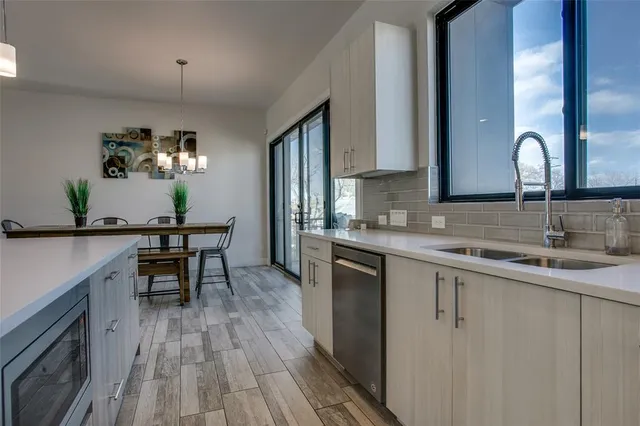 a kitchen with sink and cabinets