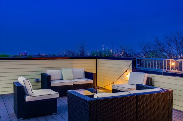 a view of a television with couches chairs