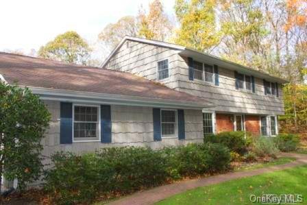 19 Stonegate Nissequogue, NY 11780 - Photo 1 of 1 a front view of a house with garden