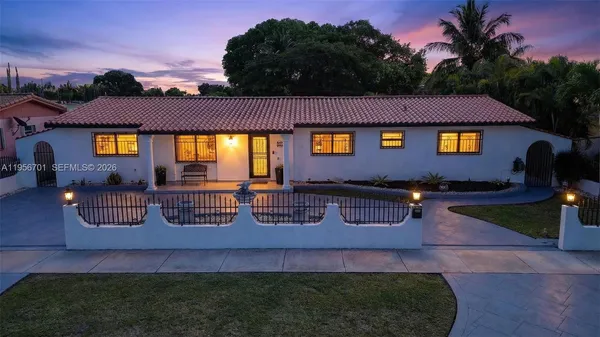 a view of house with yard
