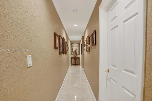 a view of a hallway with a white walls