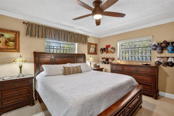 a bedroom with bed and window