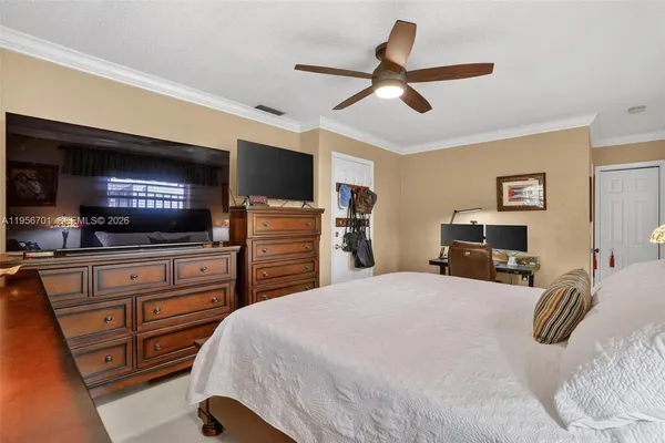 a bedroom with a bed and furniture