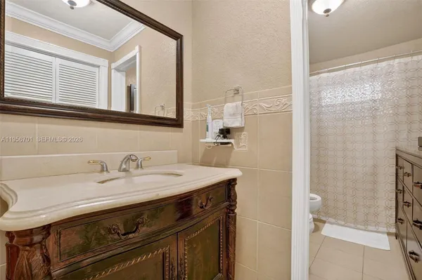 a bathroom with a sink a vanity and a mirror