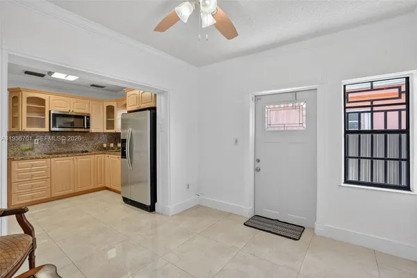 a view of a kitchen with a sink and cabinet
