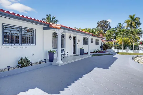 a front view of house with yard and outdoor seating