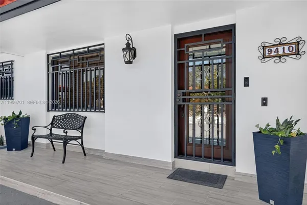 a view of a livingroom with furniture and front door