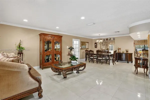 a living room with furniture and white walls