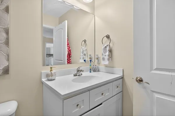 a room with a baby crib and a dresser