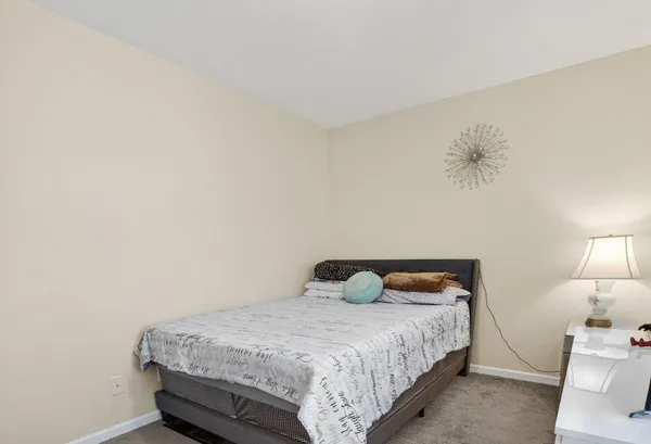 a bathroom with a sink a toilet and shower curtain
