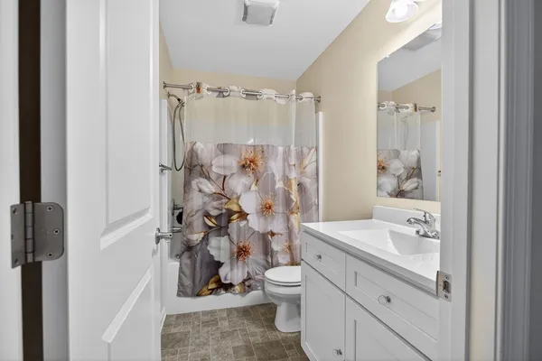 a en suite bathroom with a sink and a mirror