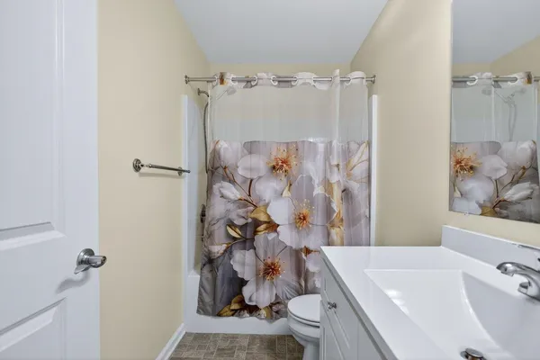 a room with a bed and window