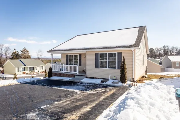 a view of a porch with a table and chair
