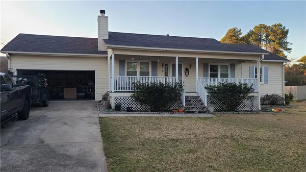 a view of house with outdoor space and porch