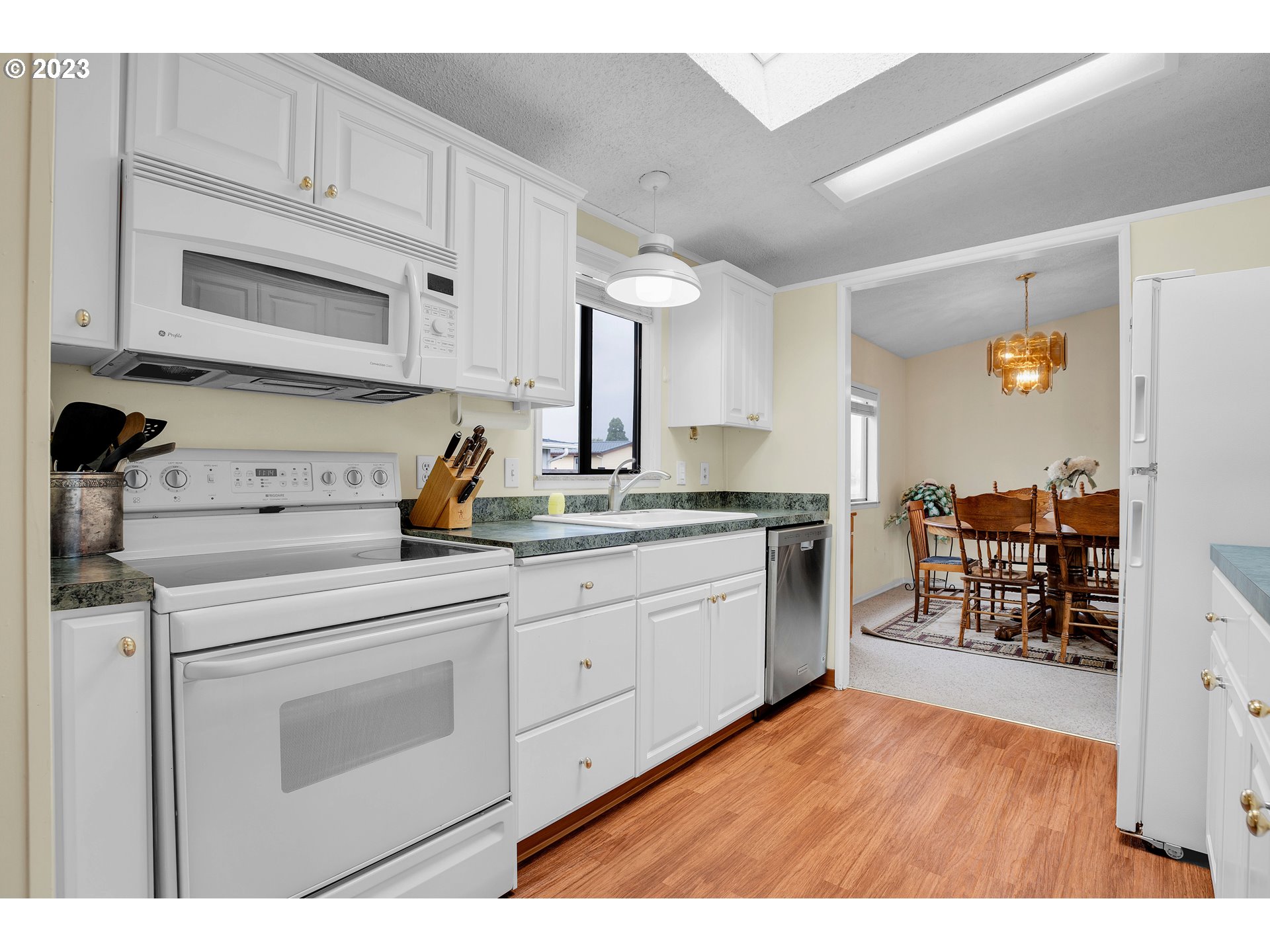 4304 Settlers Loop Forest Grove, OR 97116 - Photo 13 of 45 a kitchen with a sink and cabinets