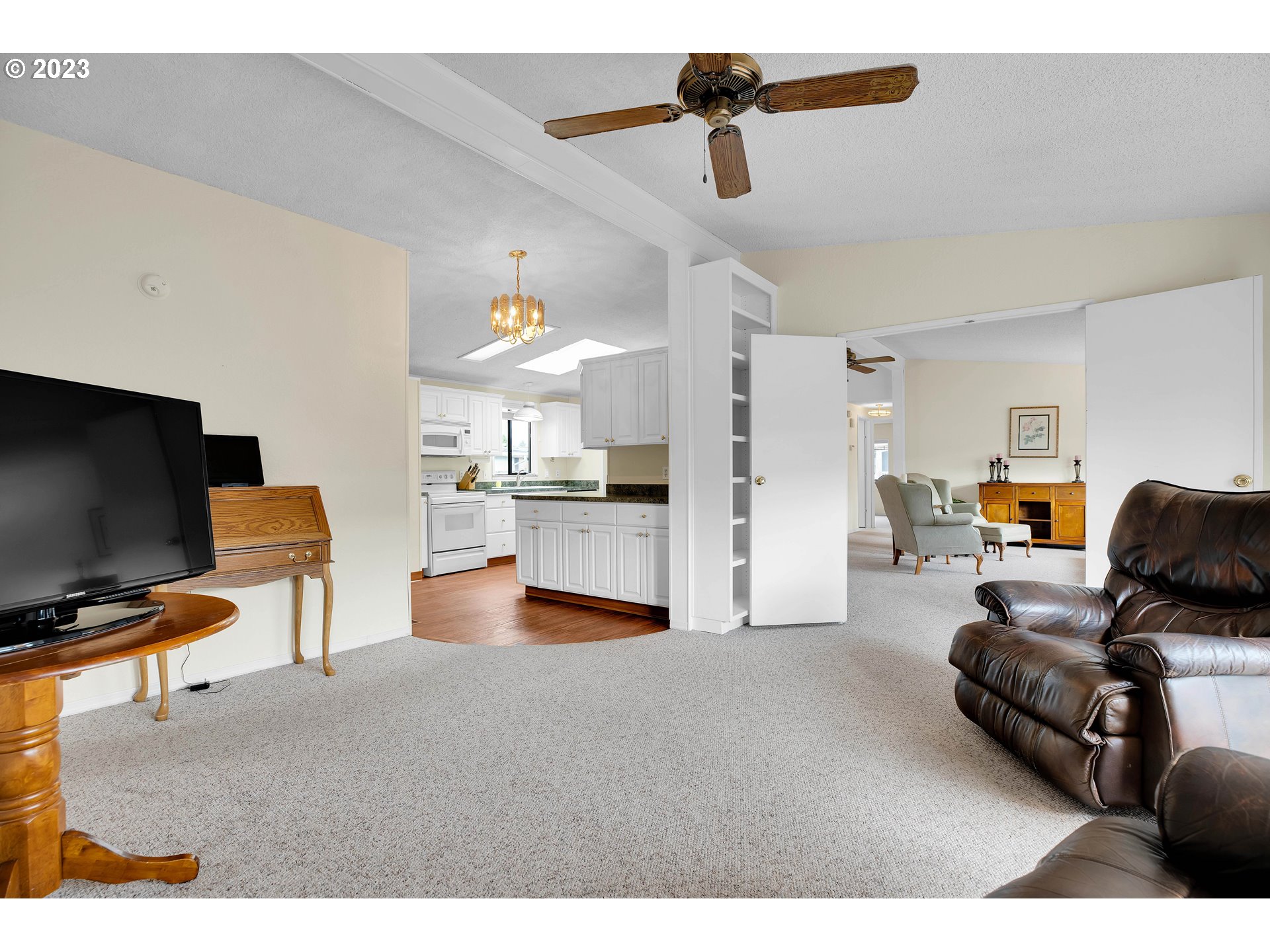 4304 Settlers Loop Forest Grove, OR 97116 - Photo 21 of 45 a living room with furniture and a flat screen tv