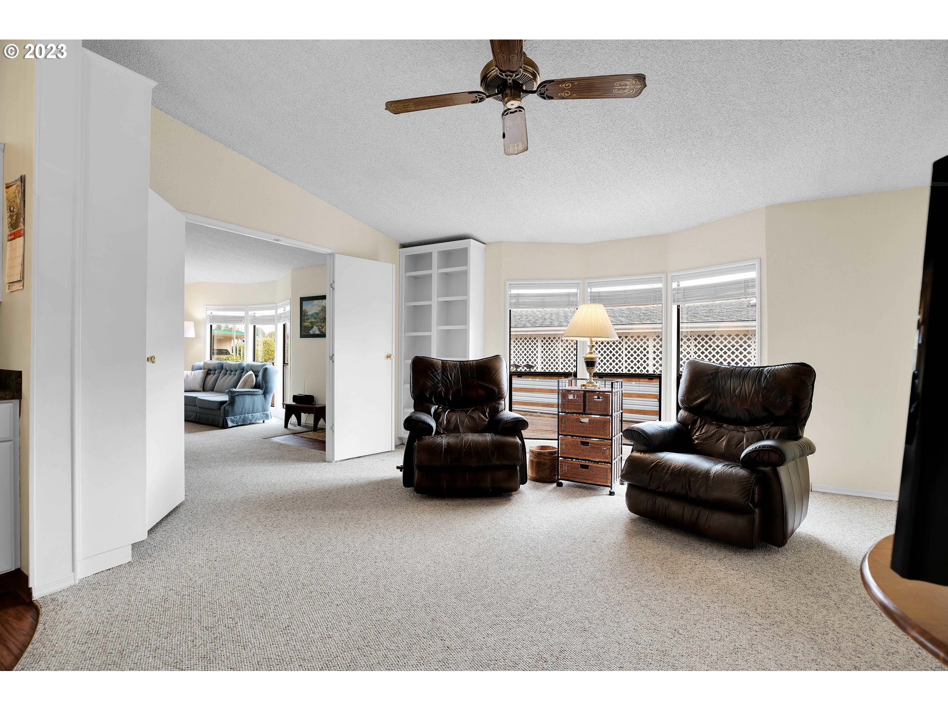 4304 Settlers Loop Forest Grove, OR 97116 - Photo 22 of 45 a living room with furniture and a chandelier