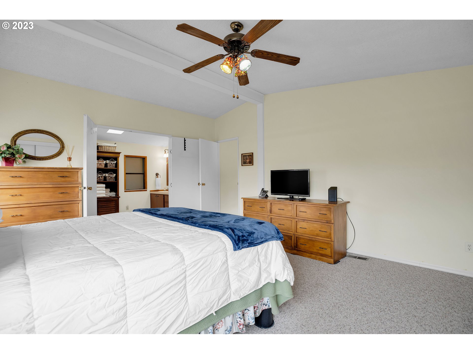 4304 Settlers Loop Forest Grove, OR 97116 - Photo 27 of 45 a bedroom with a bed and a flat screen tv