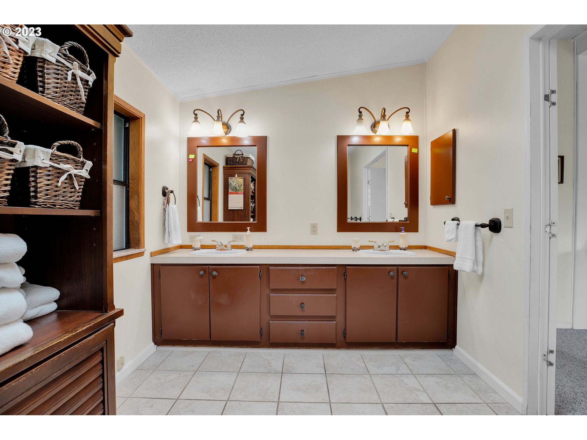 4304 Settlers Loop Forest Grove, OR 97116 - Photo 29 of 45 a bathroom with a sink a mirror and a vanity