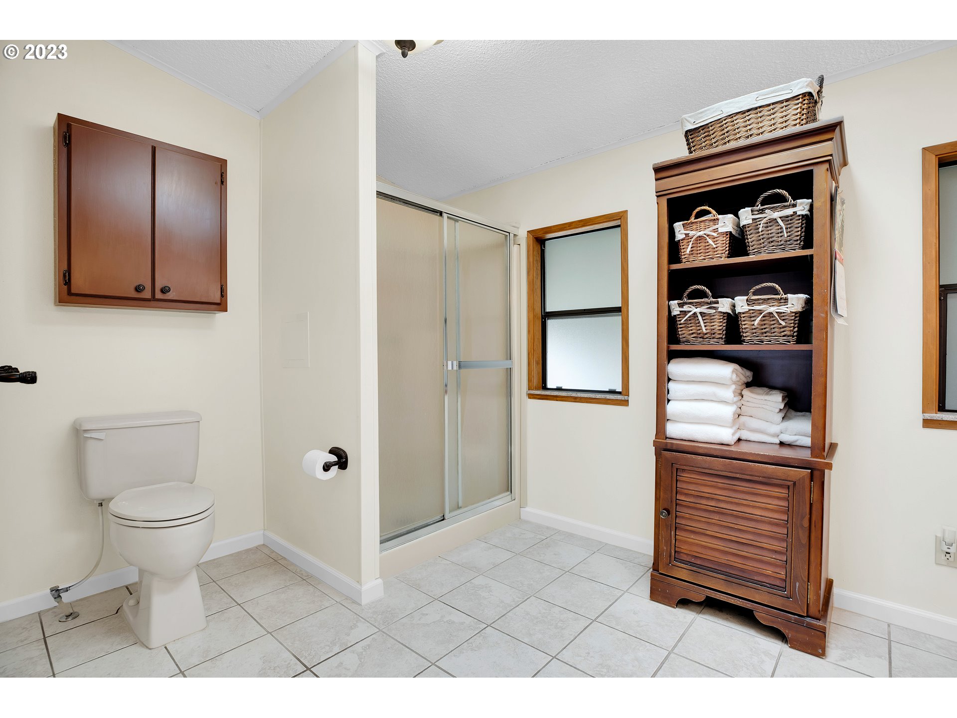 4304 Settlers Loop Forest Grove, OR 97116 - Photo 30 of 45 a bathroom with a toilet a sink and shower