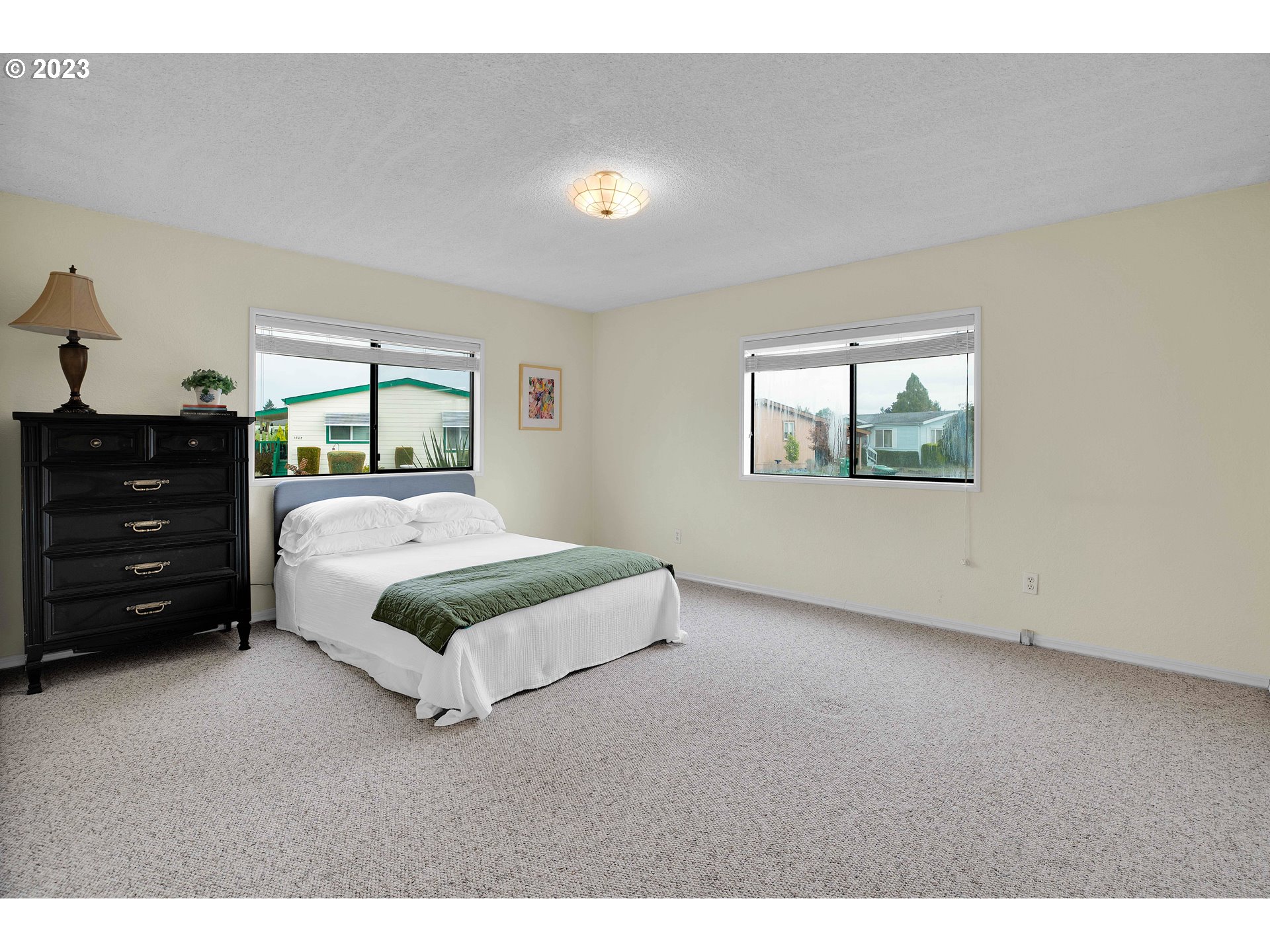 4304 Settlers Loop Forest Grove, OR 97116 - Photo 31 of 45 a bedroom with a bed and a dresser