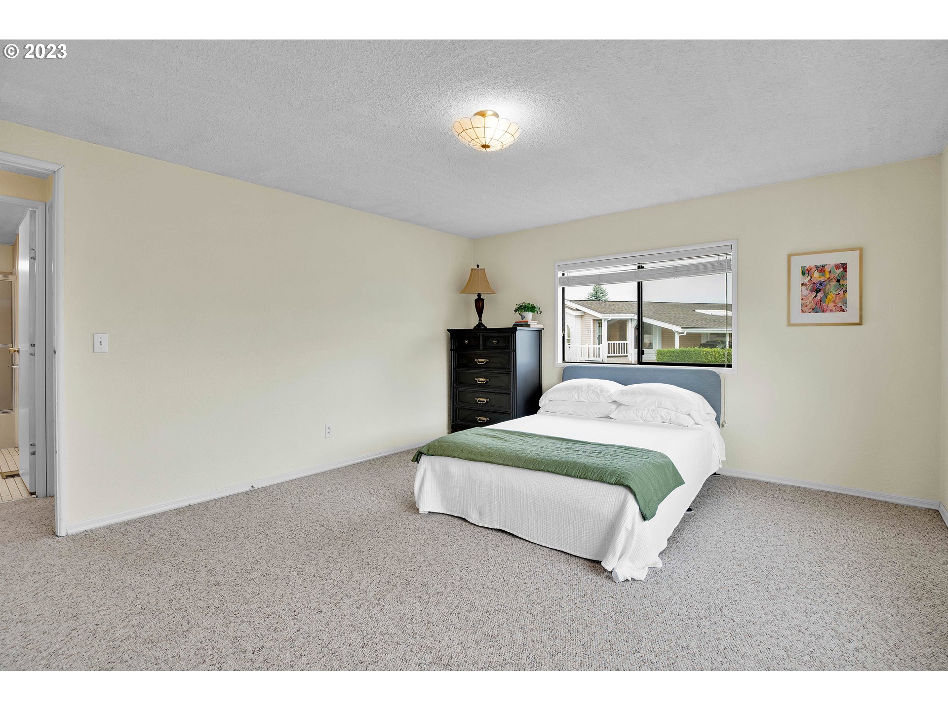 4304 Settlers Loop Forest Grove, OR 97116 - Photo 32 of 45 a bedroom with a bed and dresser