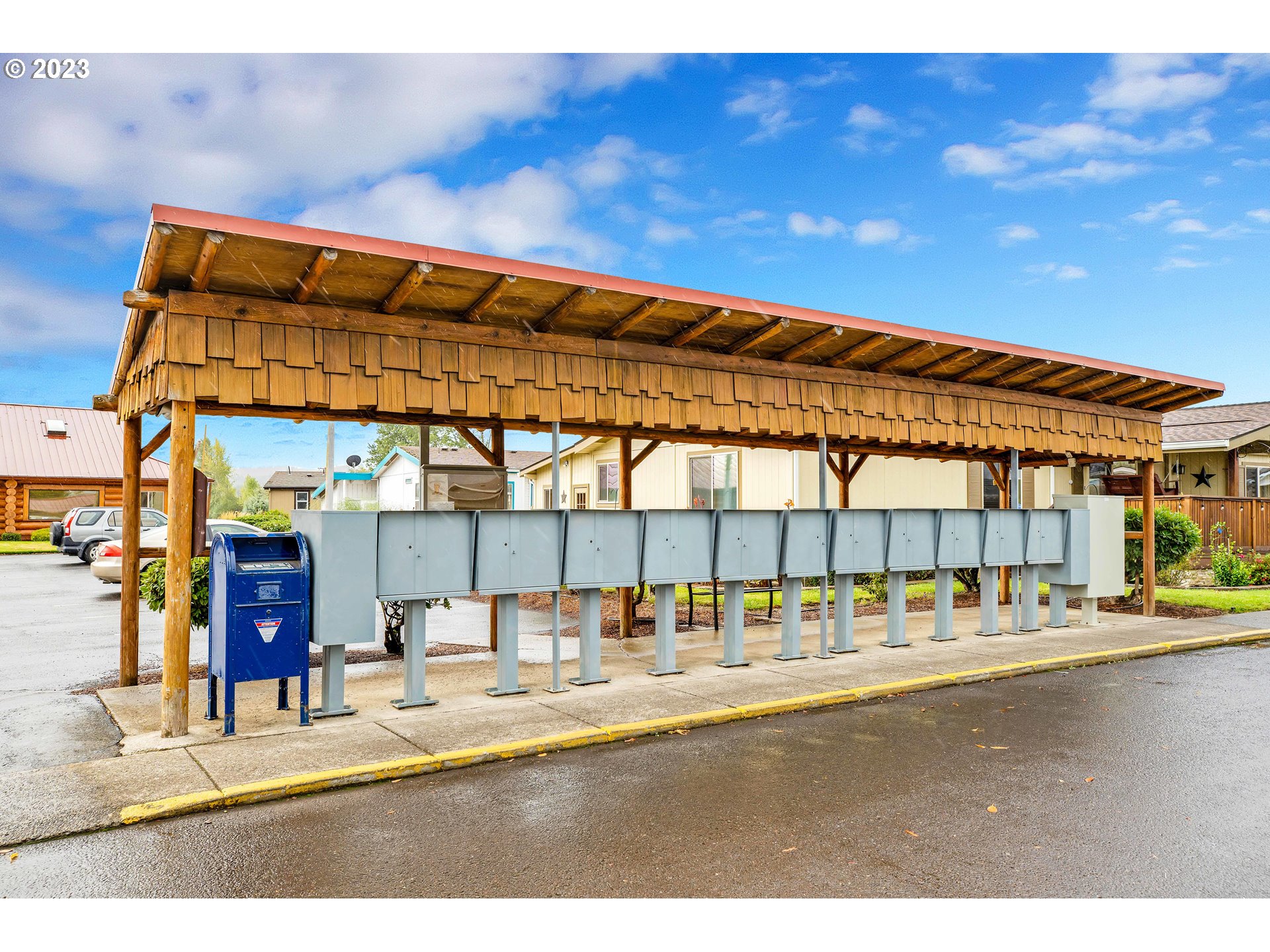 4304 Settlers Loop Forest Grove, OR 97116 - Photo 44 of 45 a view of tall building with large trees and outdoor seating