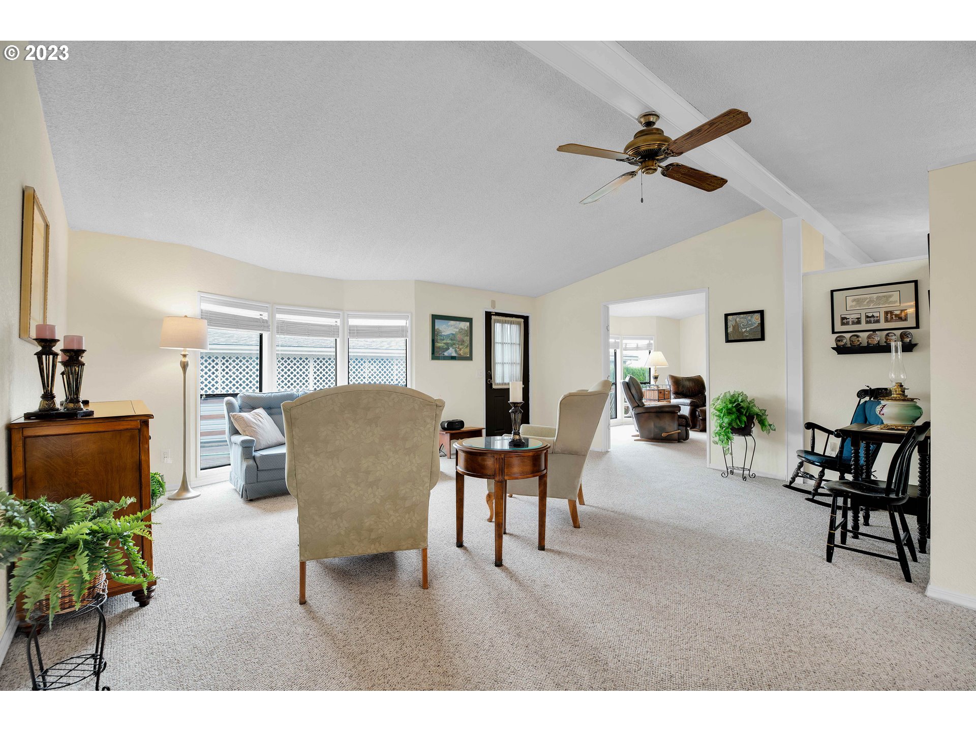 4304 Settlers Loop Forest Grove, OR 97116 - Photo 9 of 45 a living room with furniture and a flat screen tv