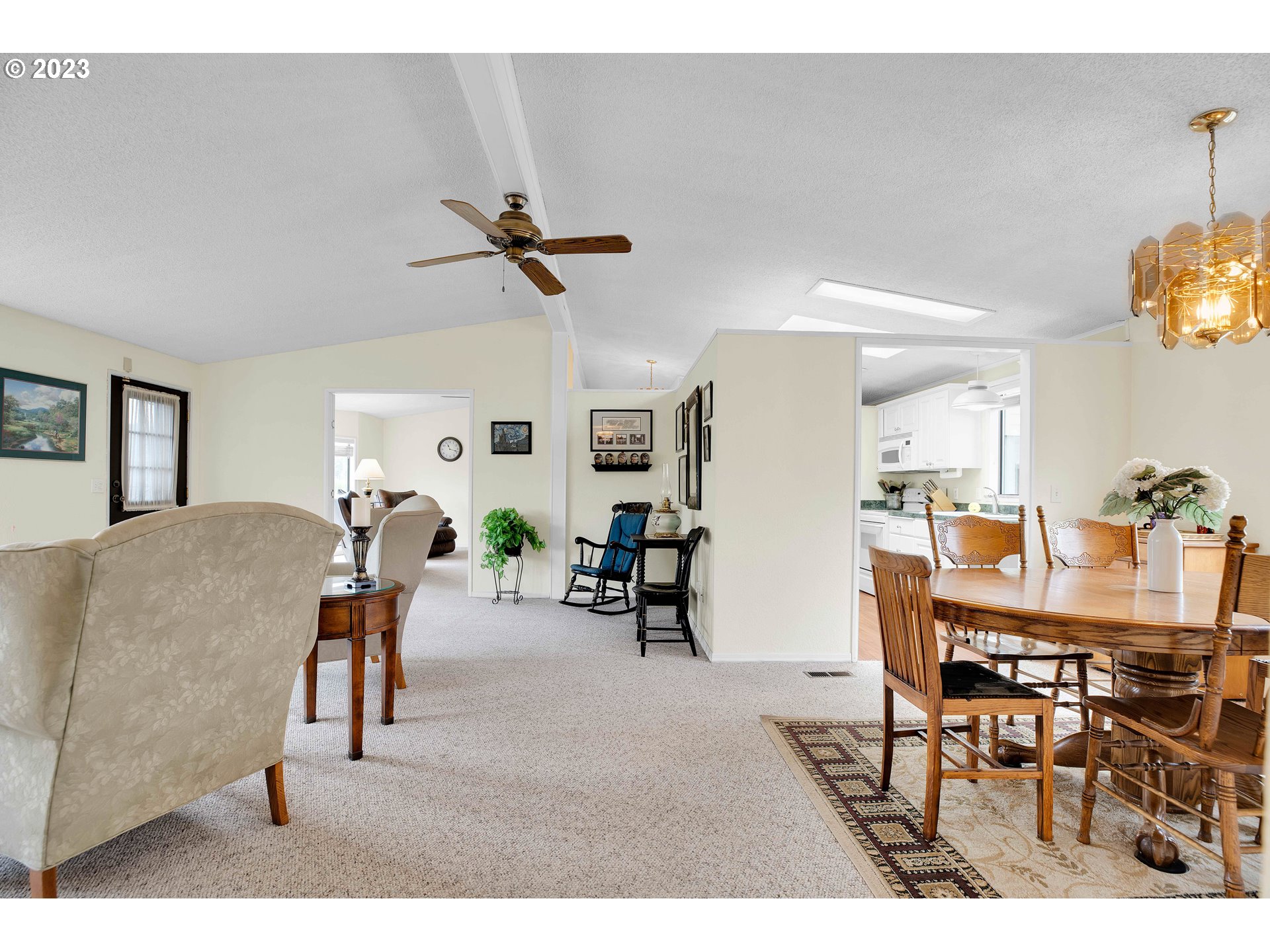 4304 Settlers Loop Forest Grove, OR 97116 - Photo 10 of 45 a view of a dining room with furniture and a chandelier