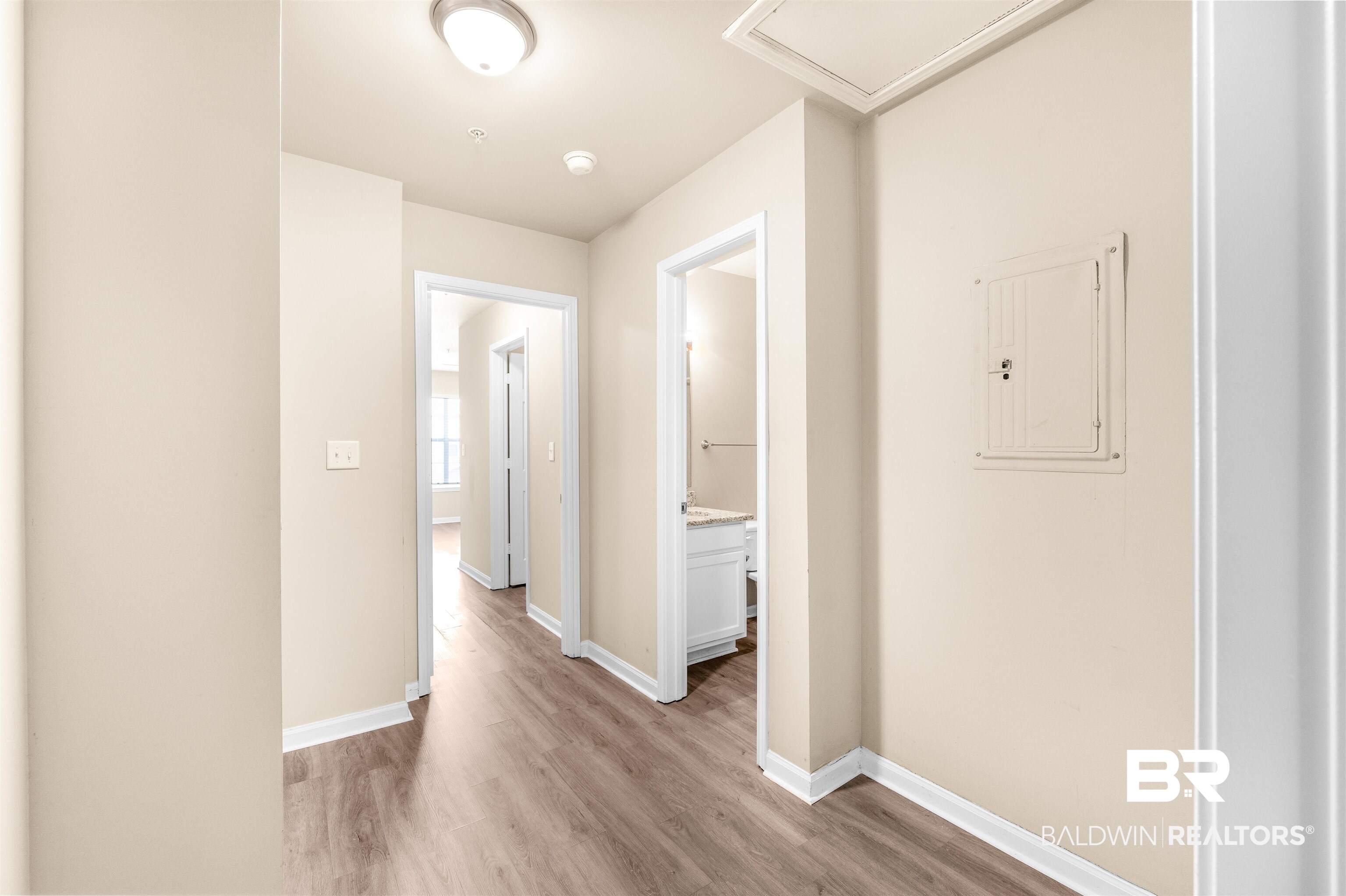 1517 Regency Road, Unit 85 Gulf Shores, AL 36542 - Photo 17 of 32 Hall with light hardwood / wood-style floors and electric panel