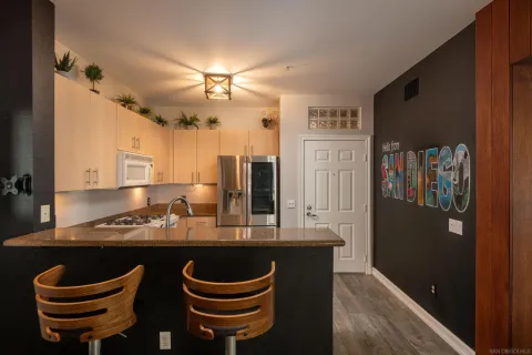 a kitchen with a sink cabinets and window