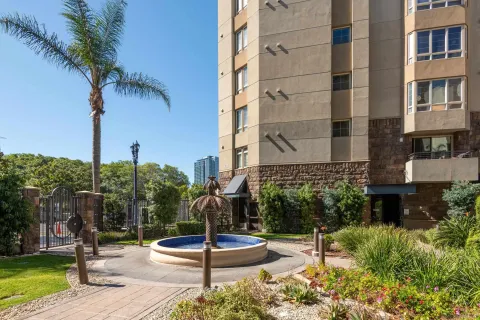 a front view of a building with garden