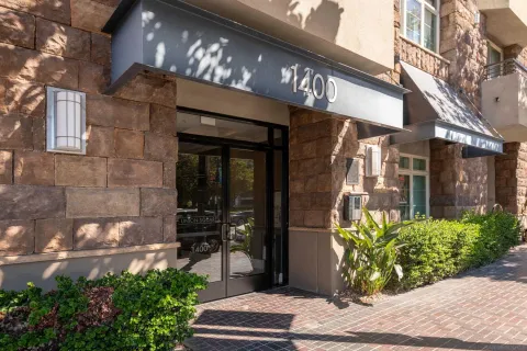 a view of a building with potted plants