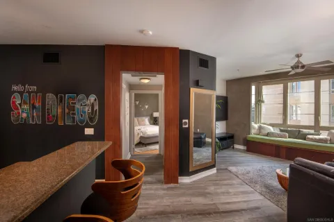 a living room with furniture and a large window