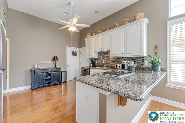 a view of a kitchen with electric appliances