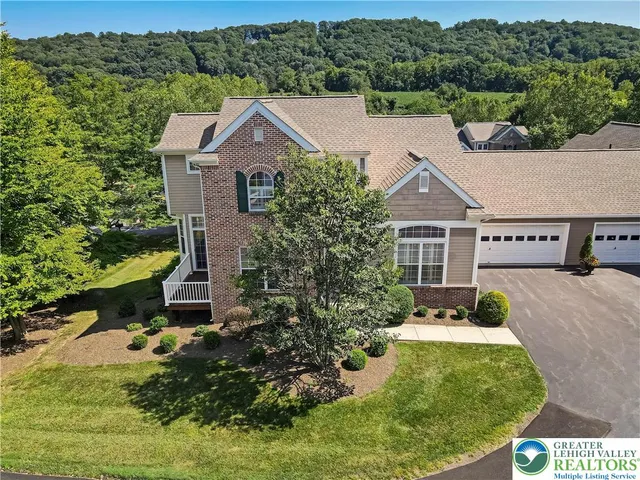 an aerial view of a house with a garden