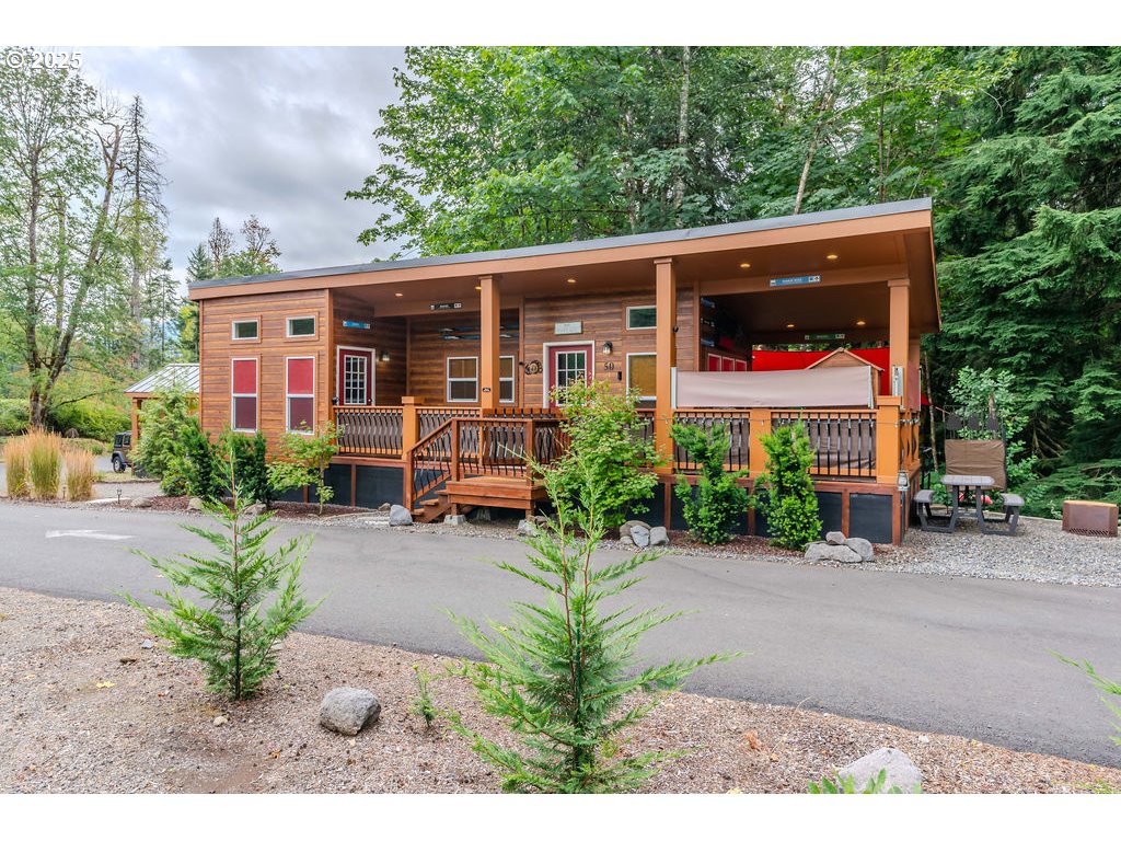 65000 Highway 26, Unit WFB50 Welches, OR 97067 - Photo 1 of 30 a view of a house with backyard garden and swimming pool