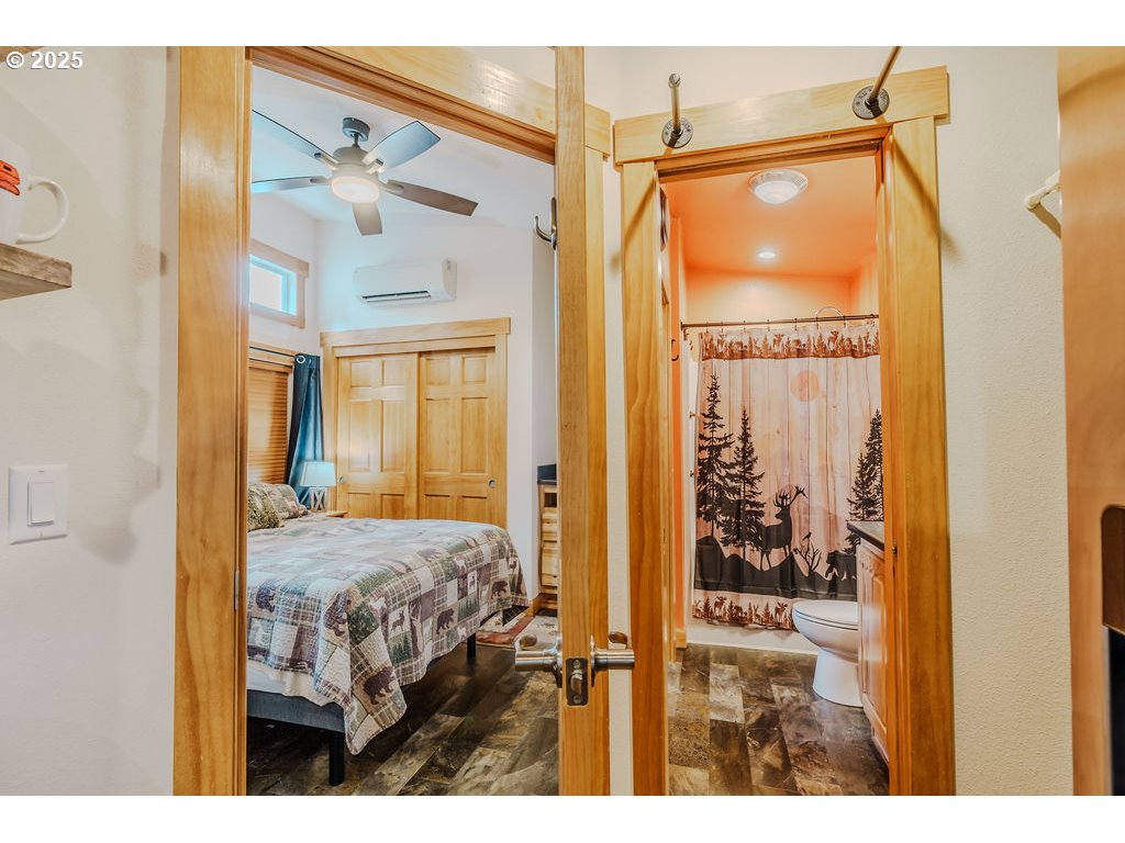 65000 Highway 26, Unit WFB50 Welches, OR 97067 - Photo 14 of 30 a view of a bedroom with a large window and front door