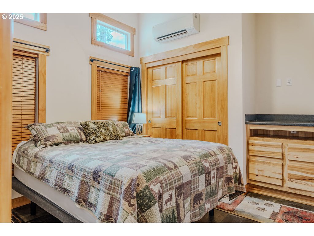 65000 Highway 26, Unit WFB50 Welches, OR 97067 - Photo 16 of 30 a bedroom with a bed and a dresser