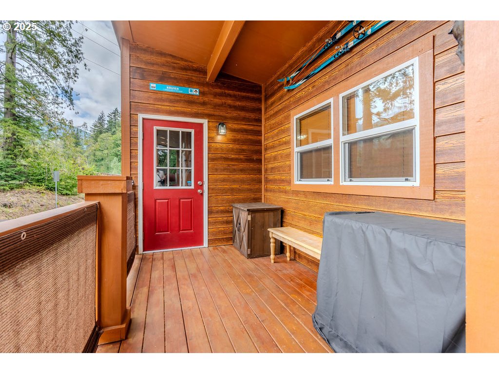 65000 Highway 26, Unit WFB50 Welches, OR 97067 - Photo 5 of 30 a view of a house with a barbeque and wooden stairs