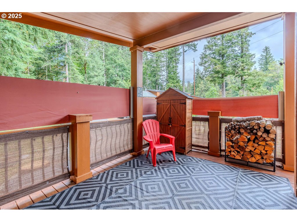65000 Highway 26, Unit WFB50 Welches, OR 97067 - Photo 7 of 30 a outdoor sitting area with furniture and wooden floor