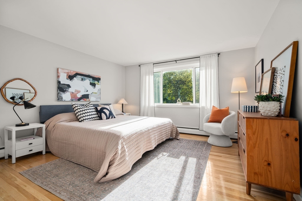 205 Kent Street, Unit 48 Brookline, MA 02446 - Photo 6 of 10 a bedroom with bed and window