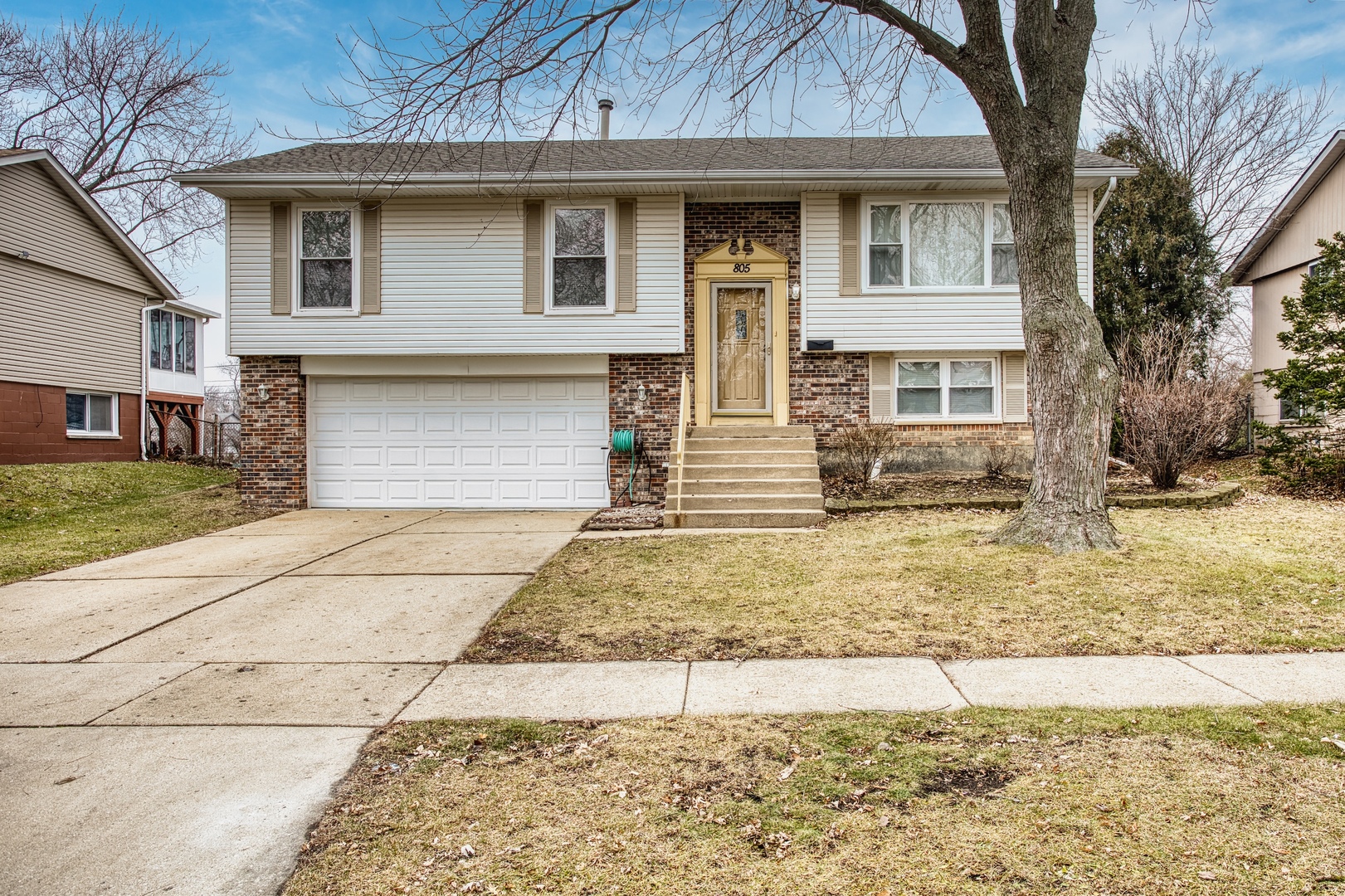 805 Stowell Avenue Streamwood, IL 60107 - Photo 1 of 30 a front view of a house with a yard