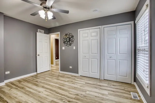 a view of a livingroom with a chandelier fan