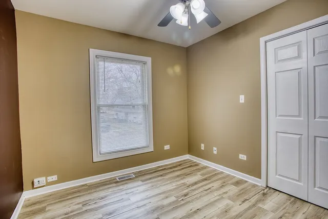 an empty room with a empty space and windows