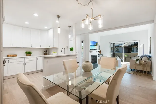 a living room with furniture a dining table and chairs