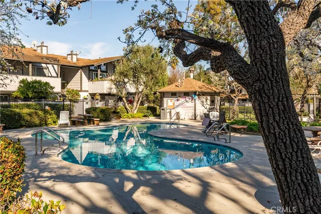 a view of a swimming pool with a patio