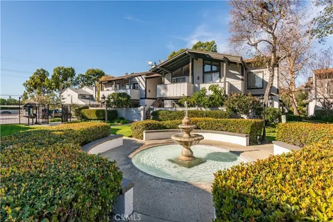 a view of a house with outdoor patio and sitting area